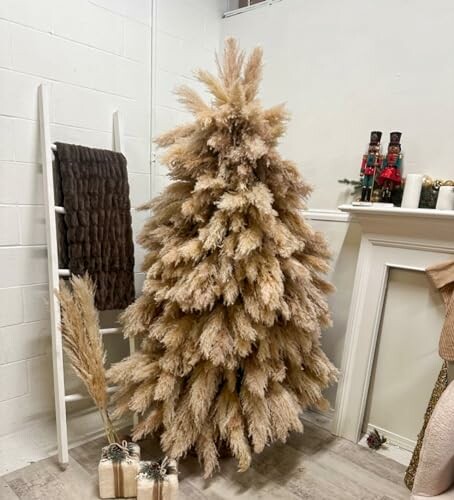 Pampas grass Christmas tree with gifts and decor.